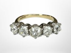An 18ct gold five-stone diamond ring, the five old-cut stones in six claw settings,