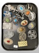 A group of decorative belt buckles.
