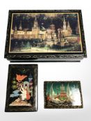 Three Russian lacquer boxes, largest 16cm wide.