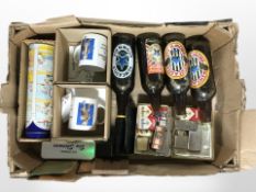 A group of lighters, bottles of Newcastle Brown Ale, Lurpak mugs, etc.