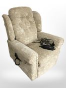 An electric reclining armchair in floral upholstery