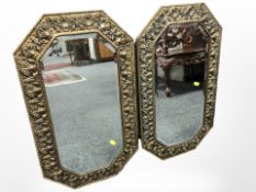 A pair of octagonal embossed brass mirrors, each 74cm x 42cm.