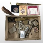A small box of collectibles including Budweiser lighter, brass letter knives,