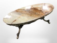 A cast brass and onyx top coffee table, 114cm long.