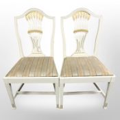 A set of ten 20th century Scandinavian cream and gilt shield back dining chairs,