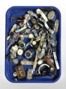 A large quantity of lady's and gent's wristwatches including Gucci, Sekonda, etc.