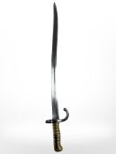 A French Chassepot sabre bayonet Modele 1866, with brass grips, manufactured Etienne 1871,