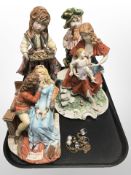Four Italian Bisque porcelain figures and groups, together with a costume pendant.