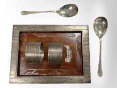 Two silver napkin rings, together with two silver teaspoons, a silver photograph frame,