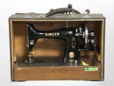 A Singer 99k sewing machine in carry case.