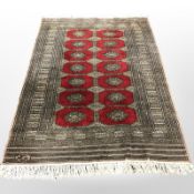 A Lahore Bokhara rug, Pakistan, signed to one end, 194cm x 131cm.