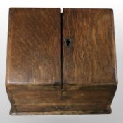 A Victorian oak sloped correspondence box,