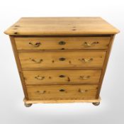 A 20th century Scandinavian pine four drawer chest on bun feet, 89cm x 49cm x 90cm.