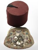 A silver coin bracelet, a lady's gilt metal mounted tapestry evening purse and a fez.