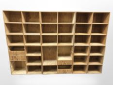 A modular pine bookcase system in seven parts,