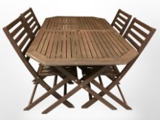 A stained teak octagonal garden table,