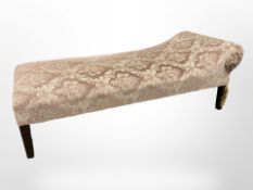An early 20th century chaise longue in peach floral upholstery,