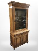 An early 20th century Danish burr walnut single glazed door bookcase,