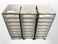 Three plastic eight-drawer index chests, height 70cm.