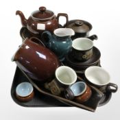 Fourteen various pieces of Denby tea and dinner stone wares in Arabesque and other patterns.