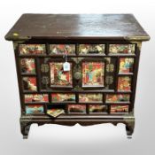 A 20th century Chinese elm brass mounted low cabinet, 65cm x 41cm x 60cm.