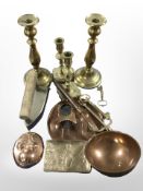 Two pairs of brass candlesticks, a copper ladle, photo frame, wall plaques,