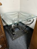 A modern bevelled glass and patinated metal square lamp table, width 70cm.