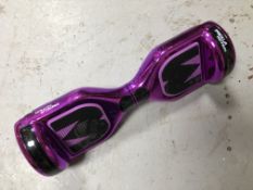 A Mega Motion hoverboard with charging lead.