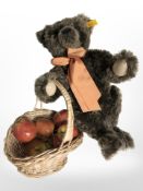 A Steiff autumn bear with basket of fruit.