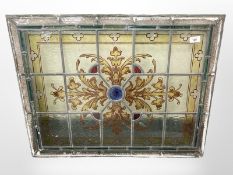 A late-Victorian/Edwardian stained and leaded glass window panel, 79cm x 61cm.