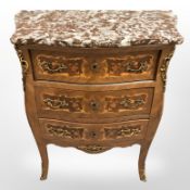 A 20th century French king wood and satin wood inlaid three drawer bombe chest with rouge marble