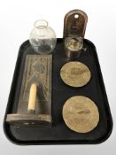 An Arts and Crafts candle wall sconce decorated with a Dutch lady,