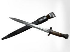 A British 1888 Mk II Lee Enfield bayonet with Mk II scabbard, blade 30cm long.