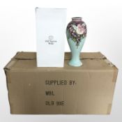 Eight matching Old Tupton Ware pottery baluster vases, height 26cm, all boxed.