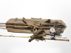 A group of vintage split cane fishing rods, reels,