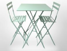 A modern folding painted metal high patio table,