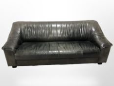 A late 20th century Danish three seater leather settee,