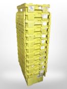 Twelve stackable plastic storage boxes with folding lids,