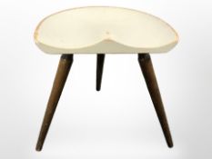 A 20th century Scandinavian tripod stool on turned splayed legs.