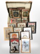 A vintage suitcase containing assorted advertising mirrors, including Martini, Ballantine's whisky,