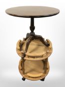 An oak two tier circular trolley and a mahogany tripod table.