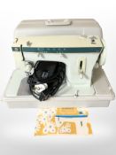 A Singer 257 electric sewing machine with lead and pedal.