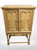 A 20th century Danish blond oak double door side cabinet, 69cm x 37cm x 108cm.