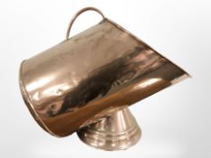An early 20th century copper coal scuttle, length 45cm.