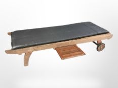 A teak garden sun lounger,
