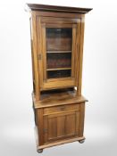 An early-20th century Danish mahogany glazed door display cabinet,