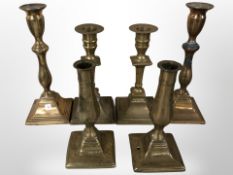 Three pairs of 19th century brass candlesticks,