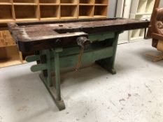 A 19th century stained and painted pine joiner's work bench fitted with two vice,
