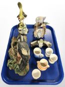 A Bossons wall plaque depicting a woodpecker, two further ceramic figures of birds,