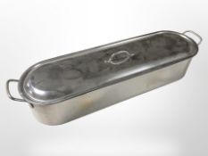 A stainless steel fish kettle, width 67cm.